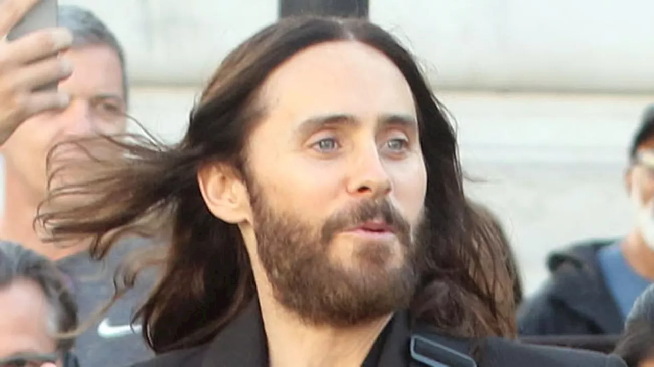 Jared Leto rocks a cropped jacket and sheer shirt as he SURPRISES fans with a FREE acoustic concert...