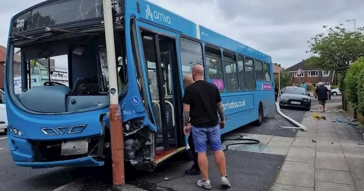 Bus mounts pavement then smashes into car and lamp posts in terrifying crash