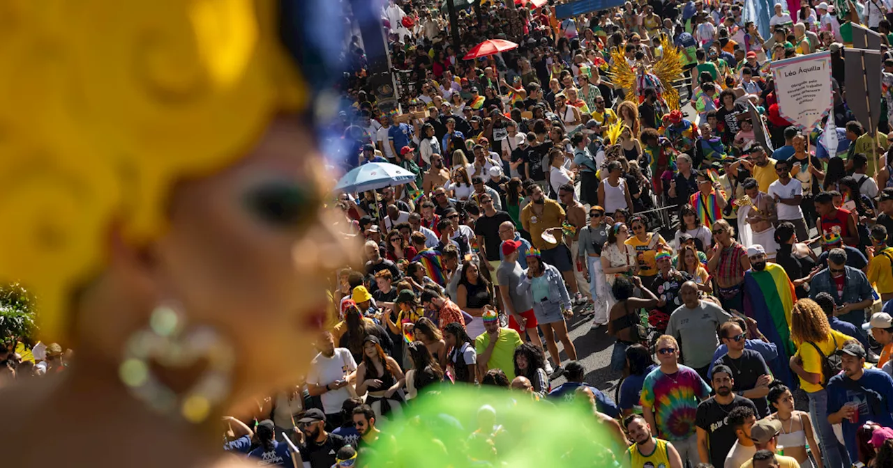 Gay pride revelers in Sao Paulo reclaim Brazil’s national symbols