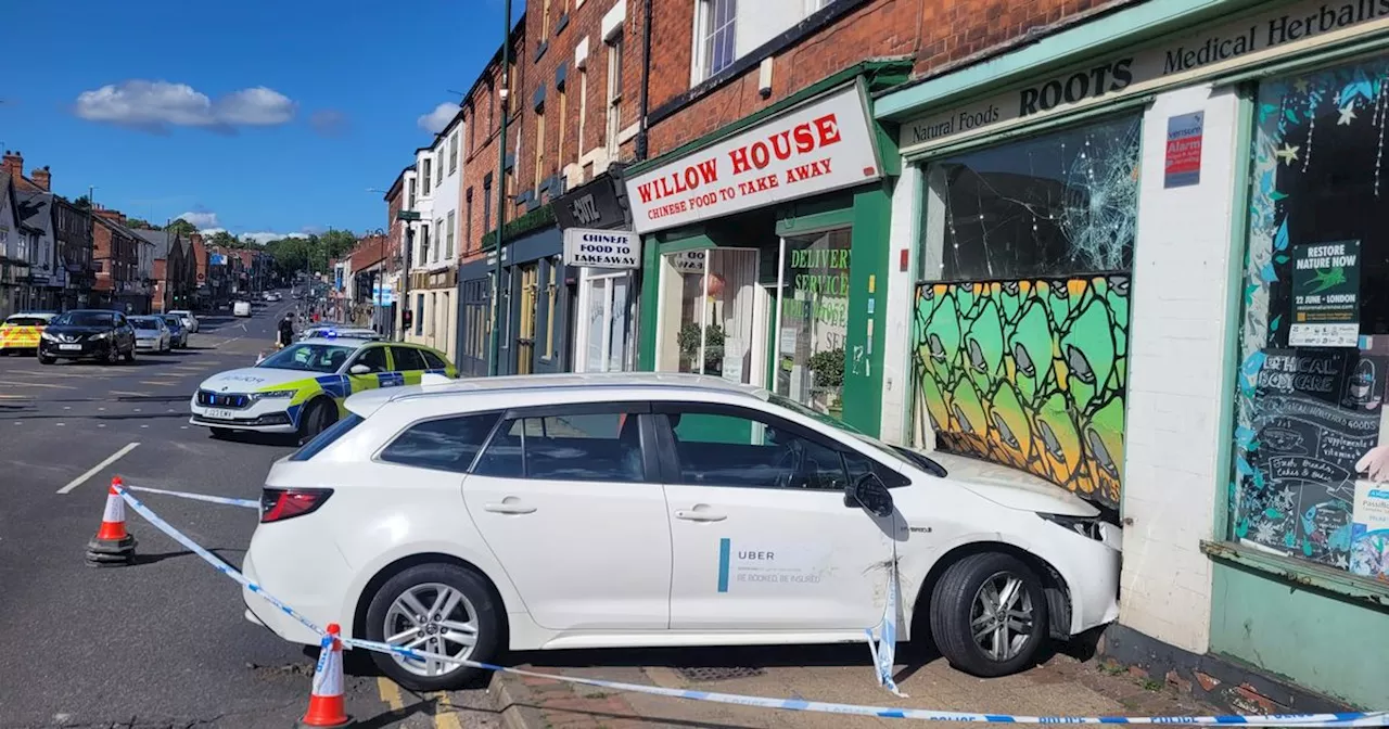 Shop owner says she thought she would faint after Uber crashed into building