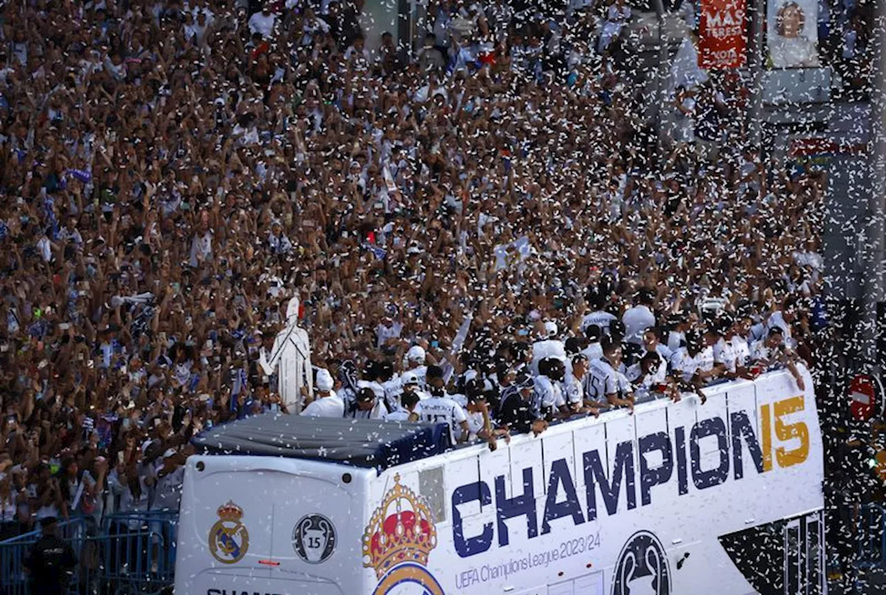 Soccer-Tens of thousands paint Madrid white after Real's Champions League win