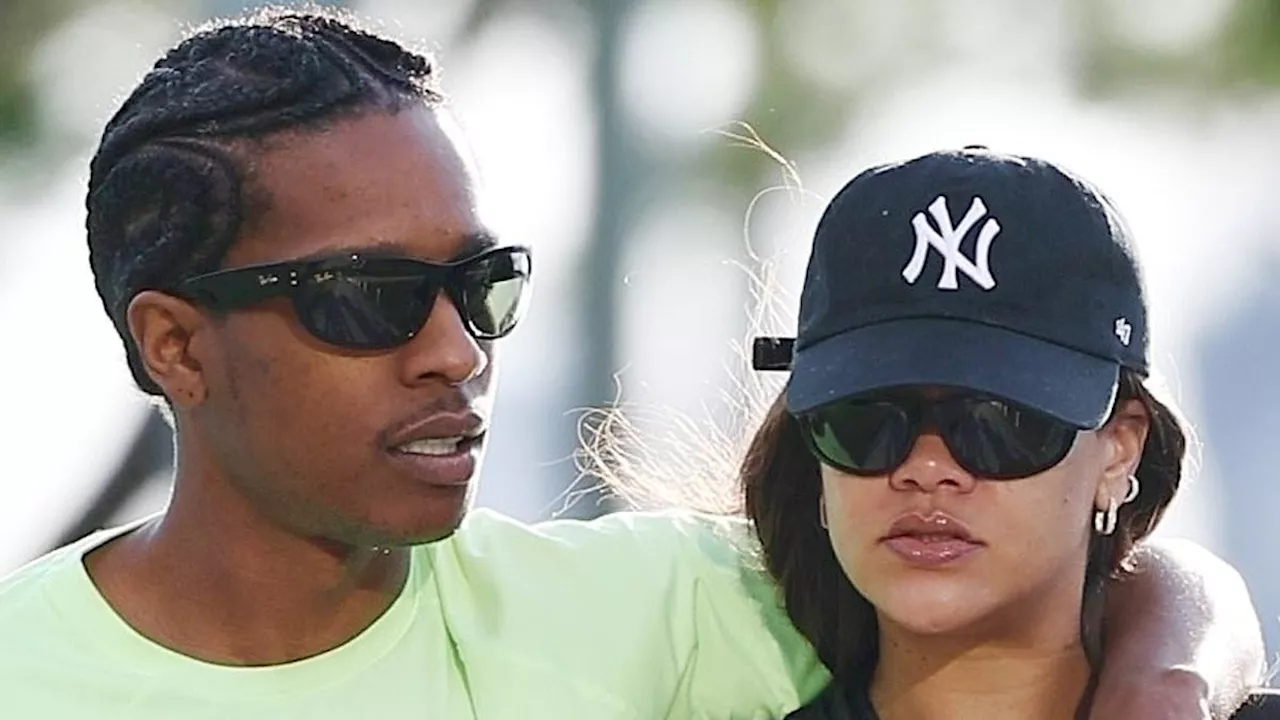 Rihanna looks sporty chic in leggings and a NY Yankees cap during loved-up stroll with boyfriend...