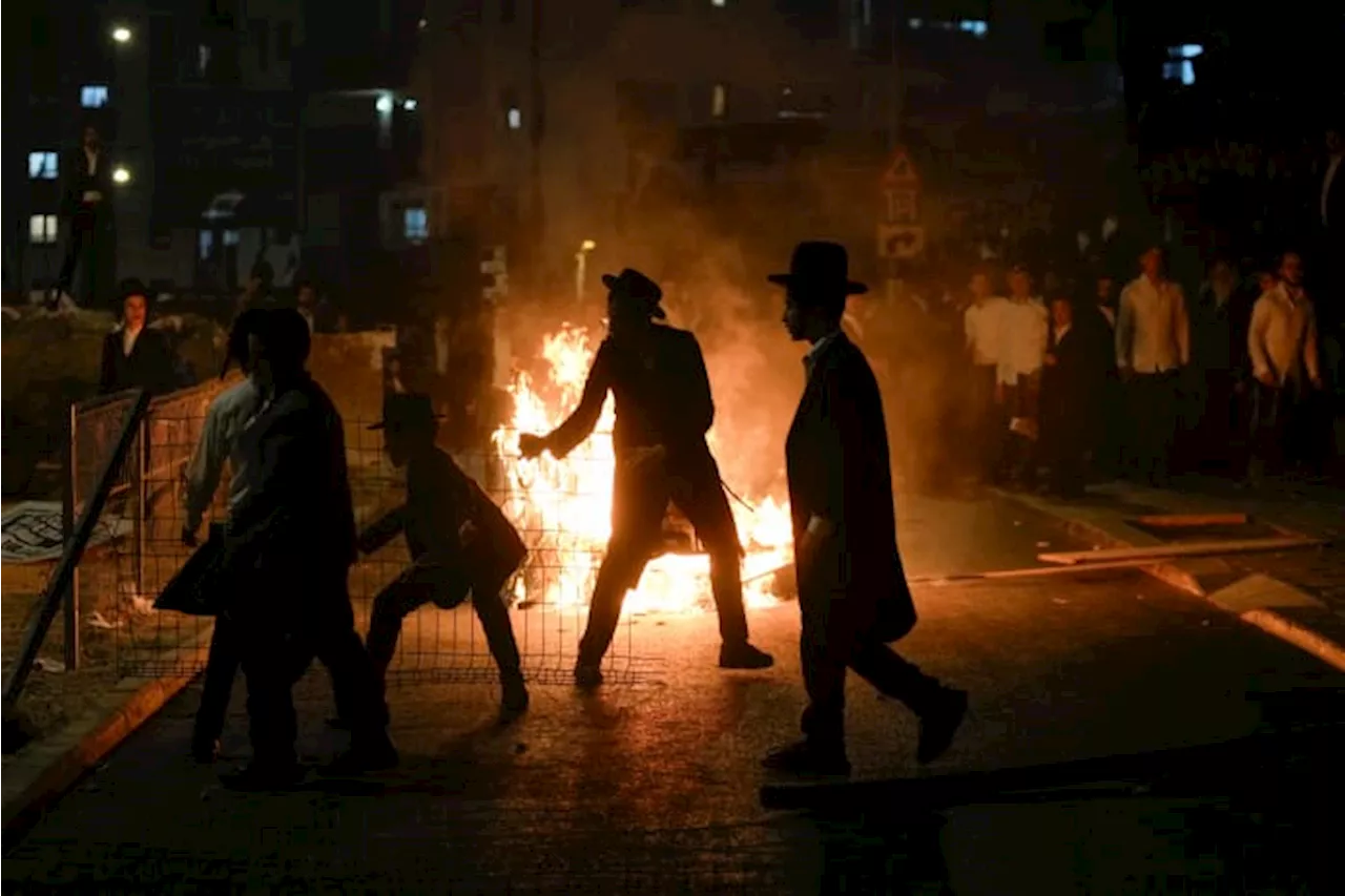 Ultra-Orthodox protest against order to enlist in Israeli military turns violent in Jerusalem