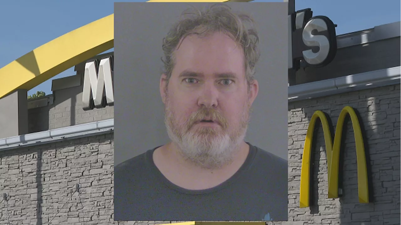 Man at McDonald's 'acting strange, lying on the floor crying' charged with punching deputy