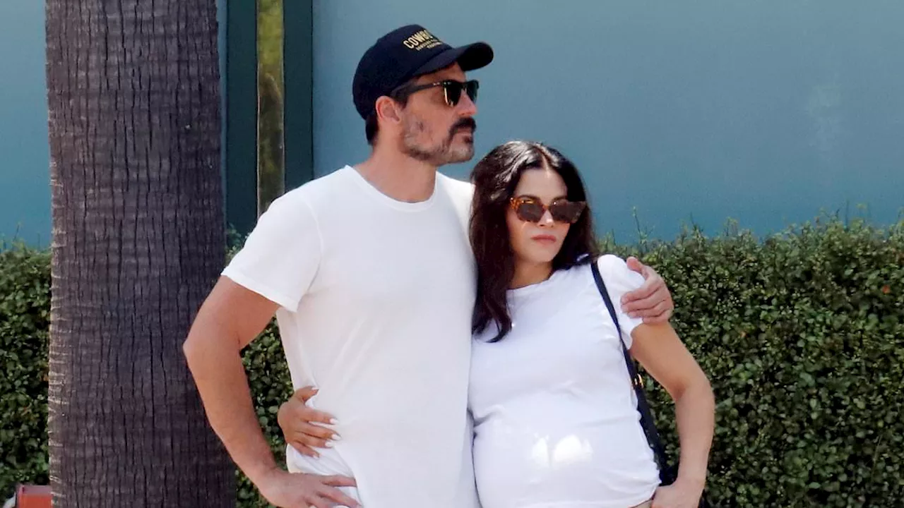 Jenna Dewan puts her baby bump on display as she cuddles up to fiance Steve Kazee in LA