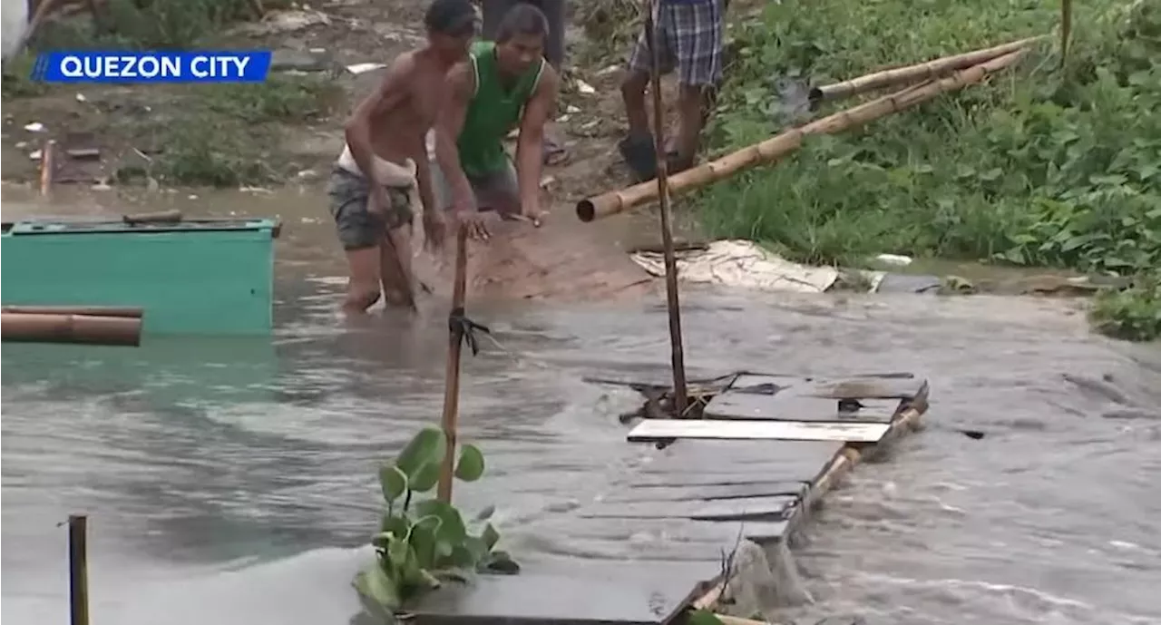 Thunderstorms flood parts of Metro Manila, destroy a makeshift bridge in QC