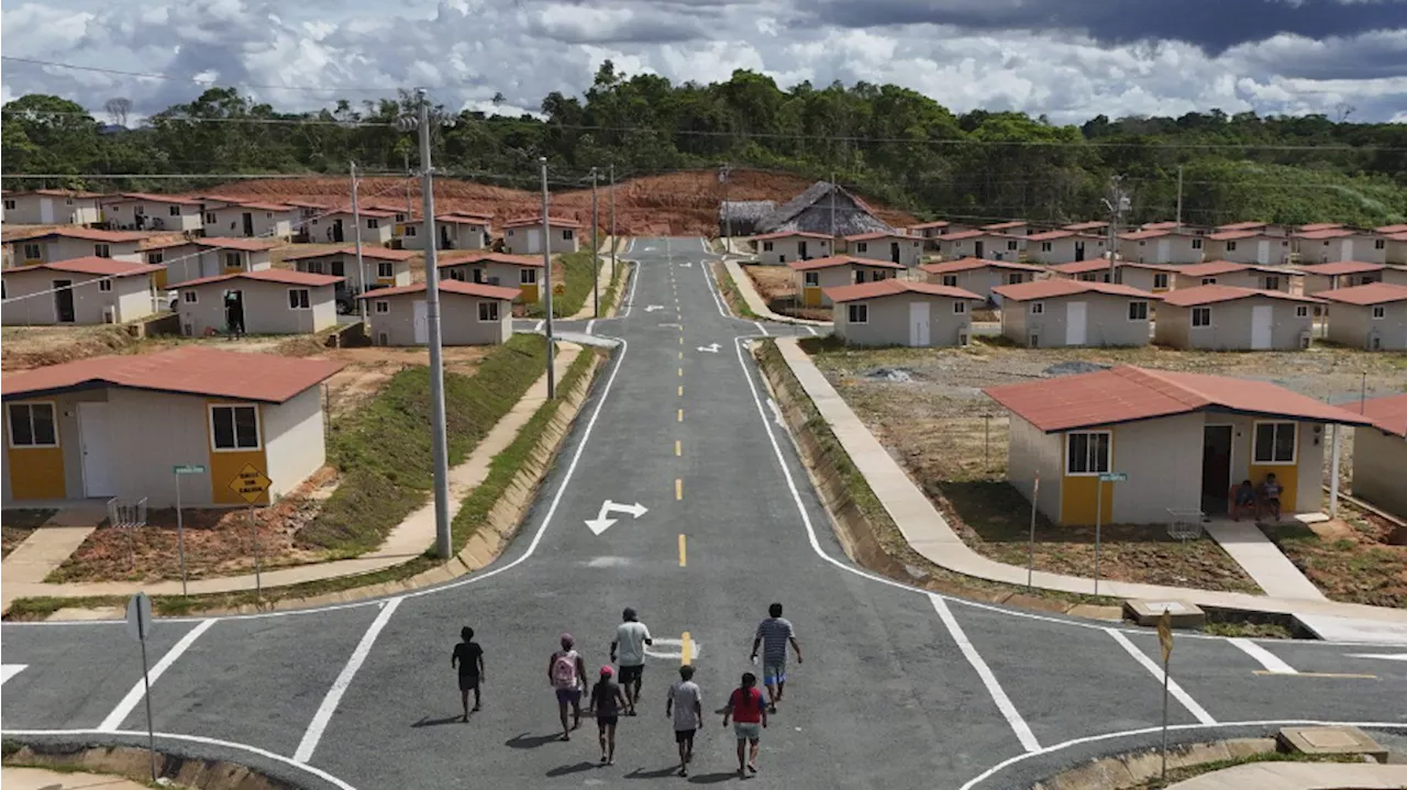 Panama community pushed from Caribbean island by rising sea levels moves into new houses