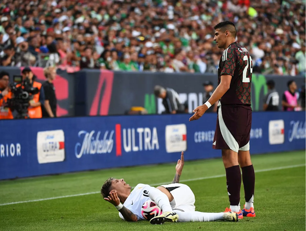 PHOTOS: Uruguay blasts Mexico before rowdy crowd at Empower Field as match ends early