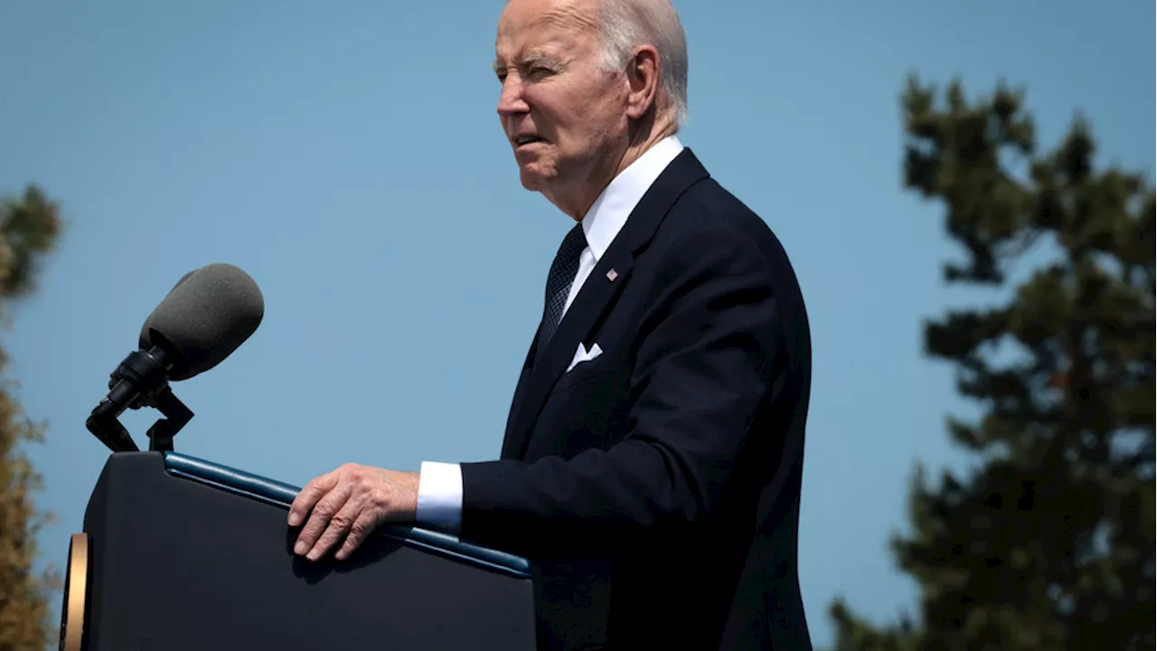 Biden appears to have trouble sitting down during D-Day remembrance event