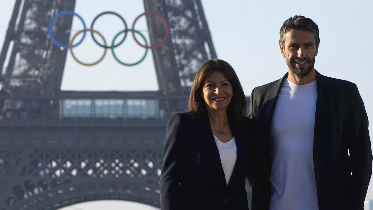 Paris Olympics organizers unveil a display of the five Olympic rings mounted on the Eiffel Tower