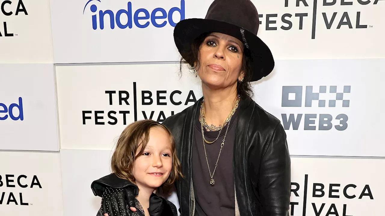 Linda Perry shows off her rock n' roll style as she's joined by son Rhodes, nine, at the premiere of...