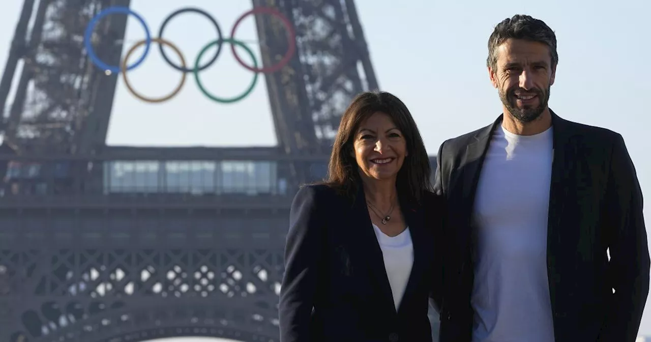 Paris Olympics organizers unveil a display of the five Olympic rings mounted on the Eiffel Tower