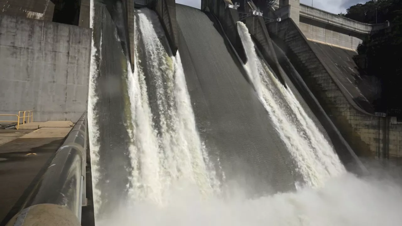 Evacuation warnings as massive dam overflows