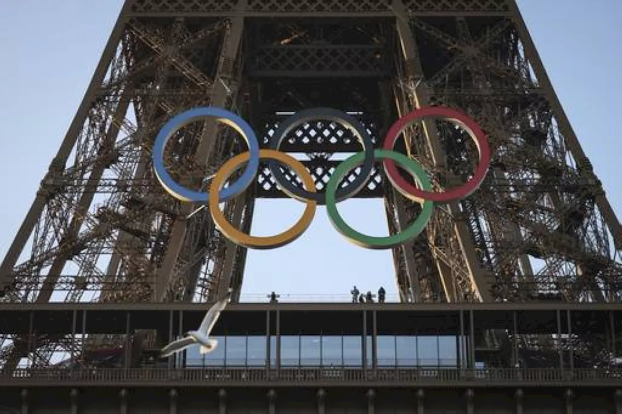 Paris Olympics organizers unveil a display of the five Olympic rings mounted on the Eiffel Tower