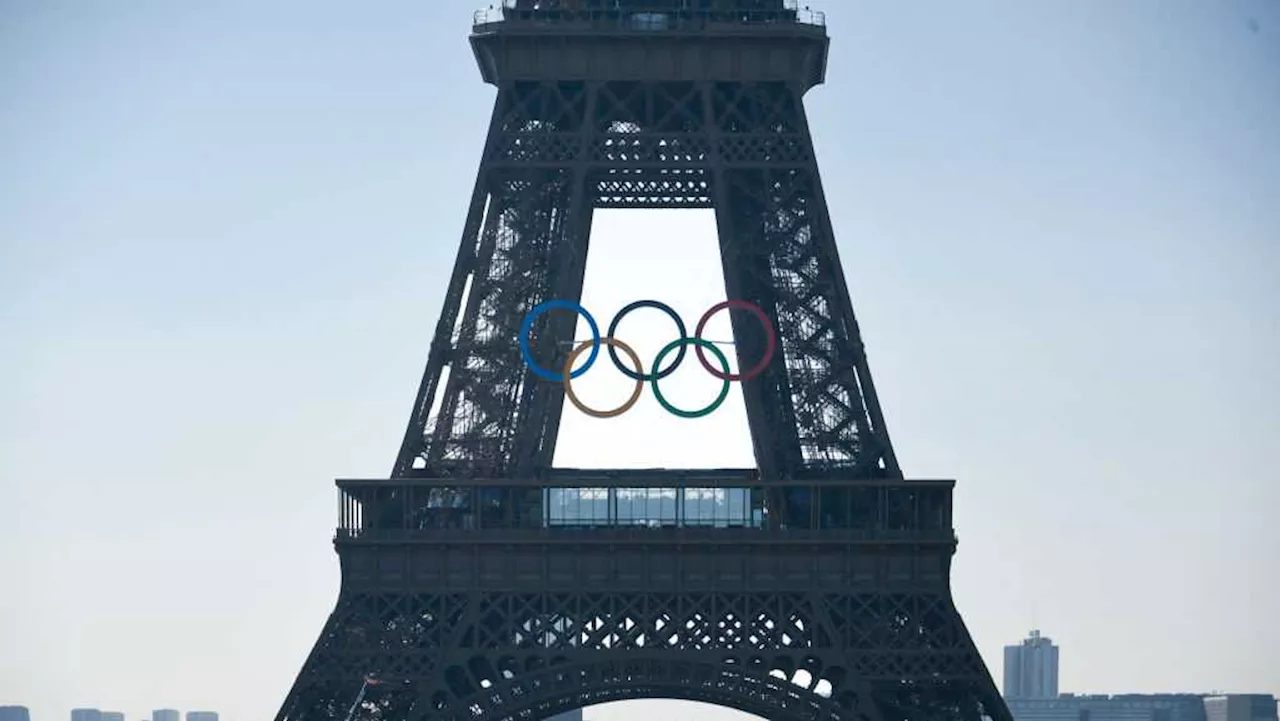 Paris Olympics organizers unveil a display of the five Olympic rings mounted on the Eiffel Tower