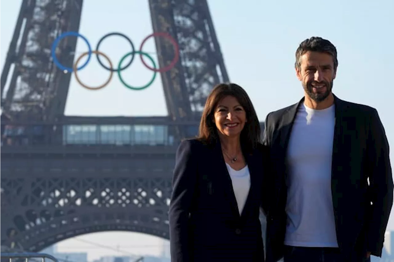 Paris Olympics organizers unveil a display of the five Olympic rings mounted on the Eiffel Tower