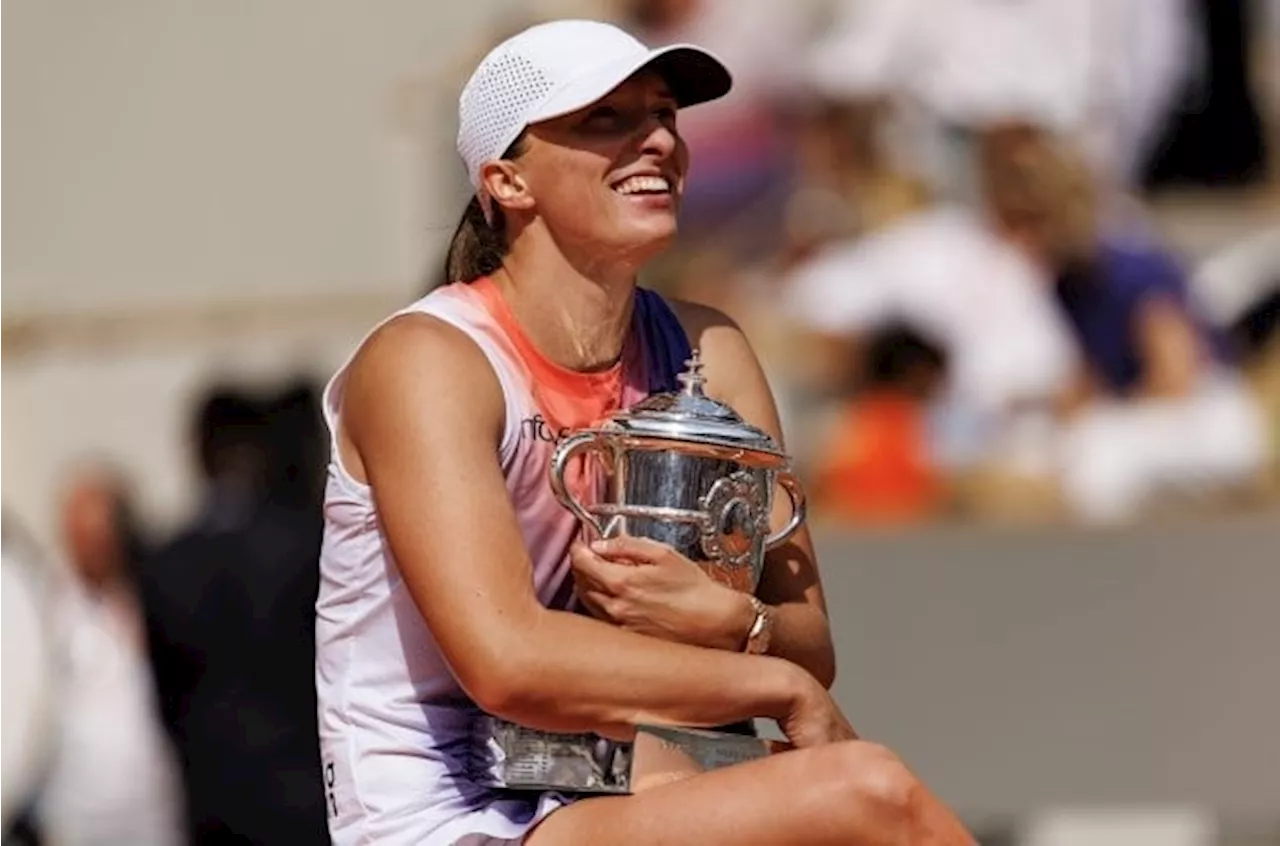 Swiatek seals place among greats with 'surreal' fourth French Open