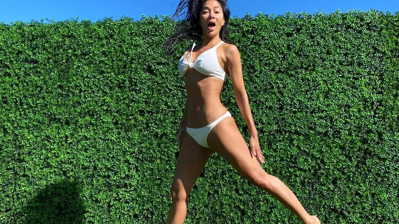 Nicole Scherzinger wows as she shows off her flexible body in tiny bikini...