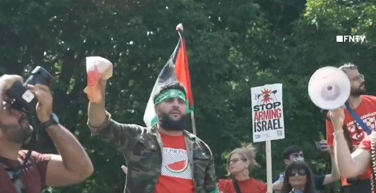 Anti-Israel agitator in Hamas headband holds up bloodied Biden face mask steps from White House