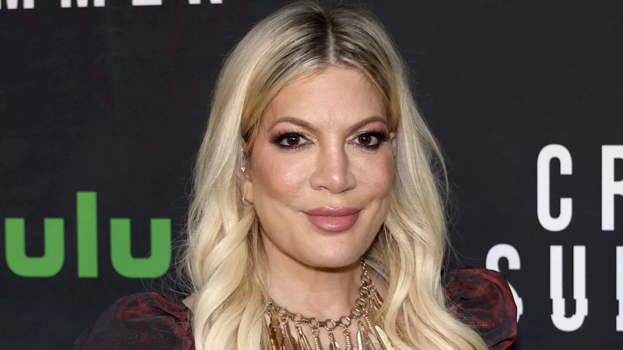 Tori Spelling showcases new dermal piercings in sweet photos from son Beau's kindergarten graduation