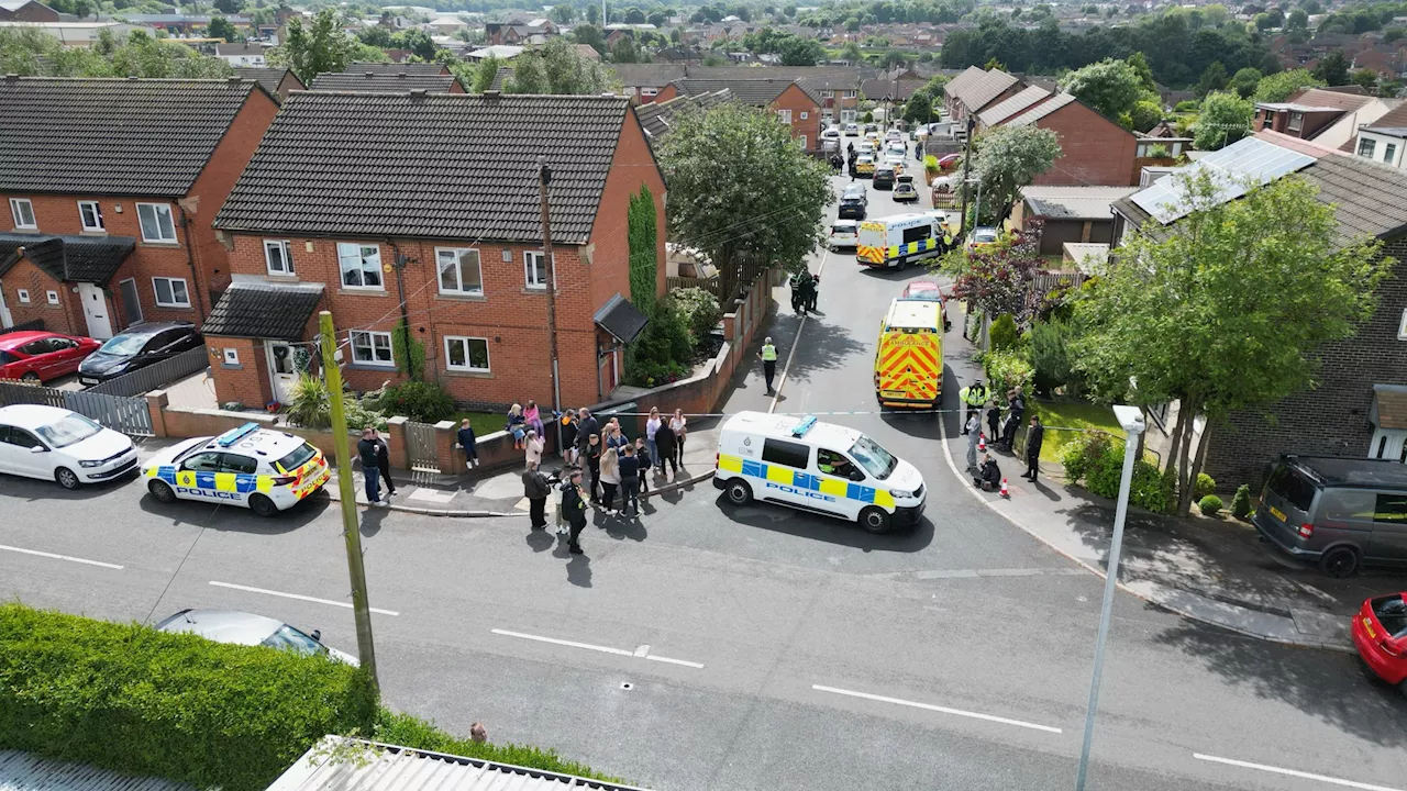 Masked cops swarm housing estate in dramatic stand-off with ‘armed’ man as neighbours ‘warned to stay insid...