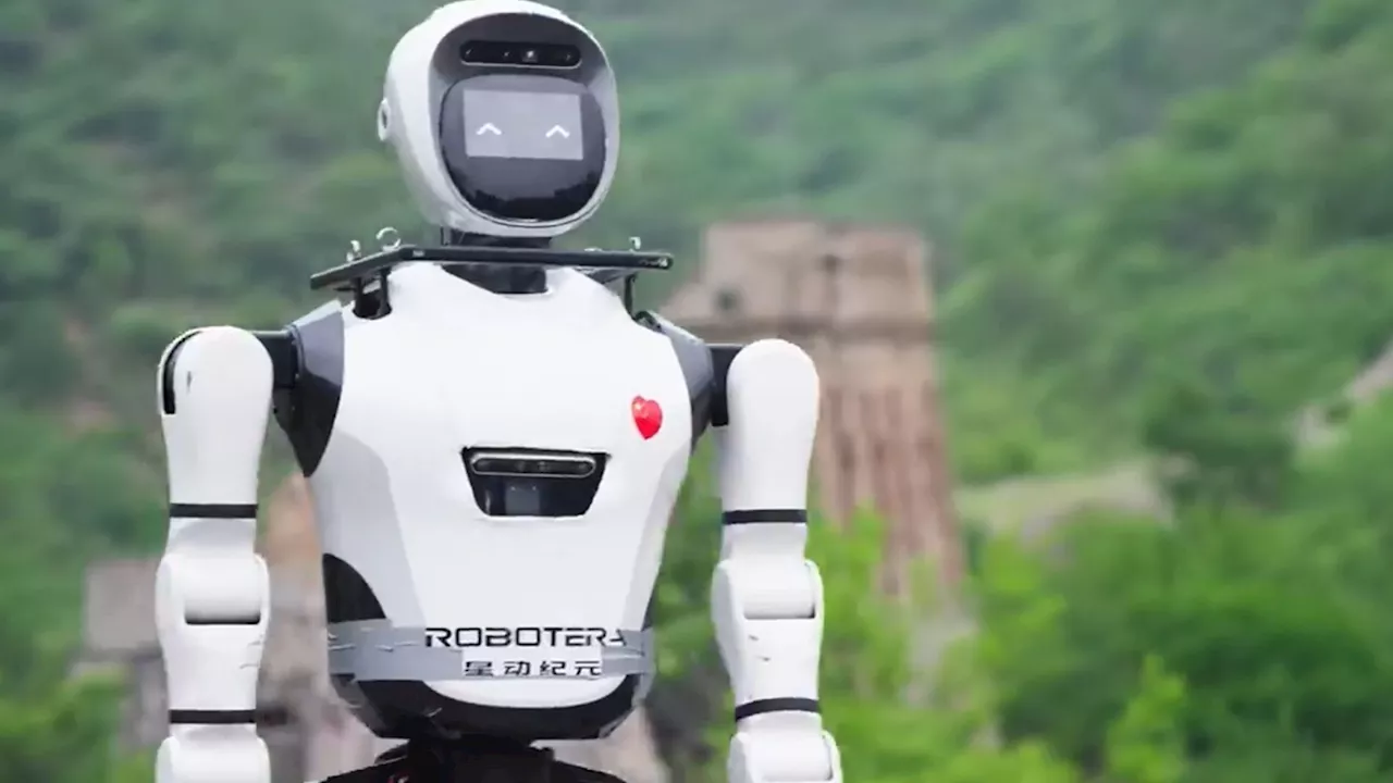 Watch moment humanoid robot climbs uneven steps and walks through darkened passageways at The Great Wall...