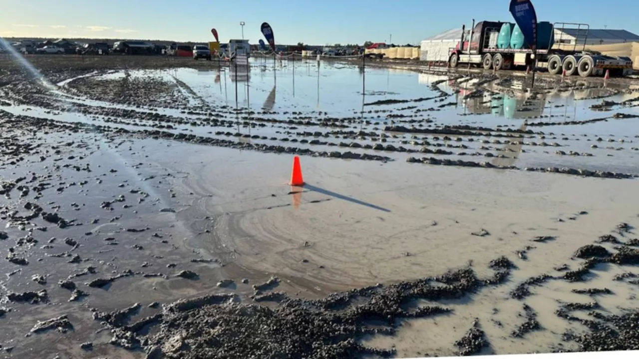 Big Red Bash festival a mud pit as deluge washes out campsite, closes roads near Birdsville