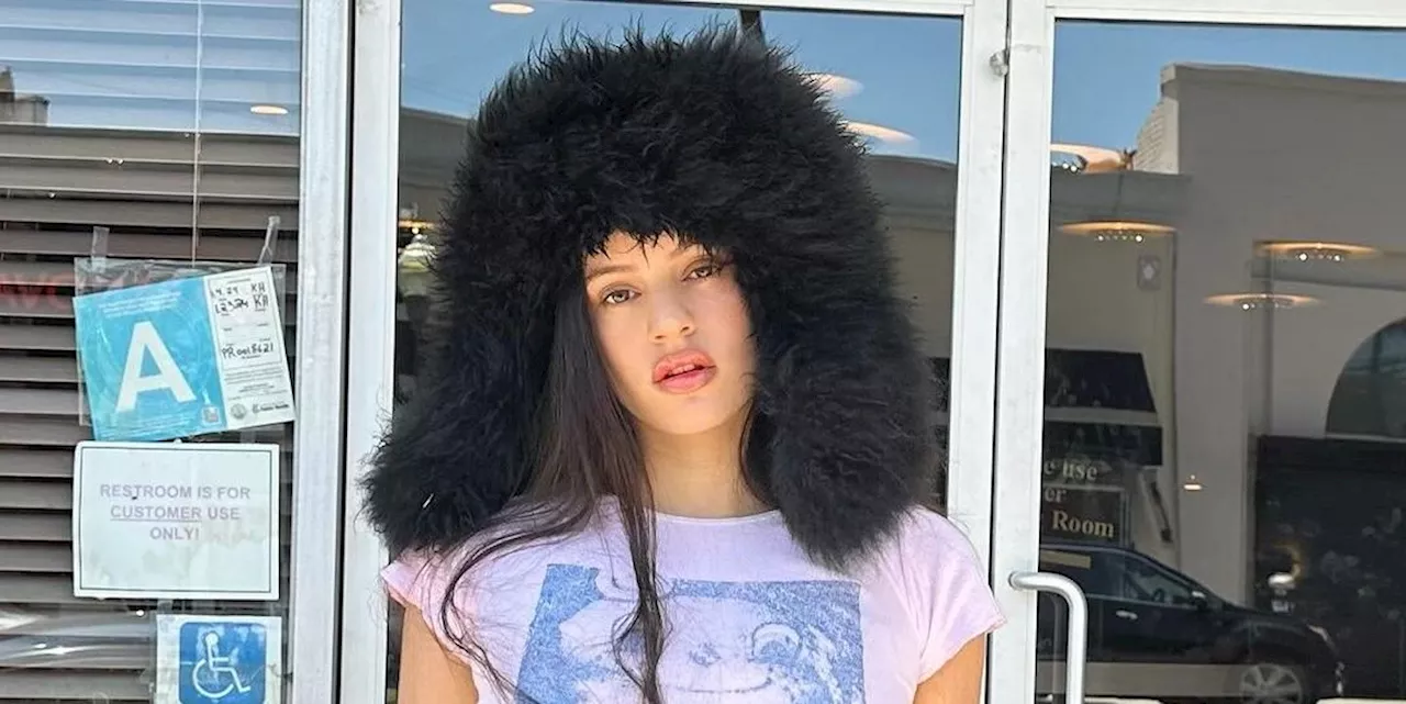 Rosalía Wears a Shearling Trapper Hat to Hunt Down Her Dior Billboard