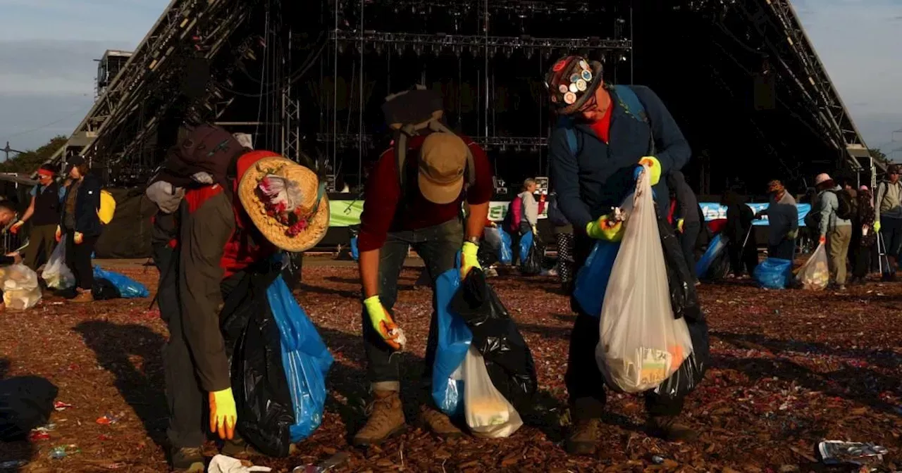 Glastonbury cleanup begins with police warning for revellers trekking