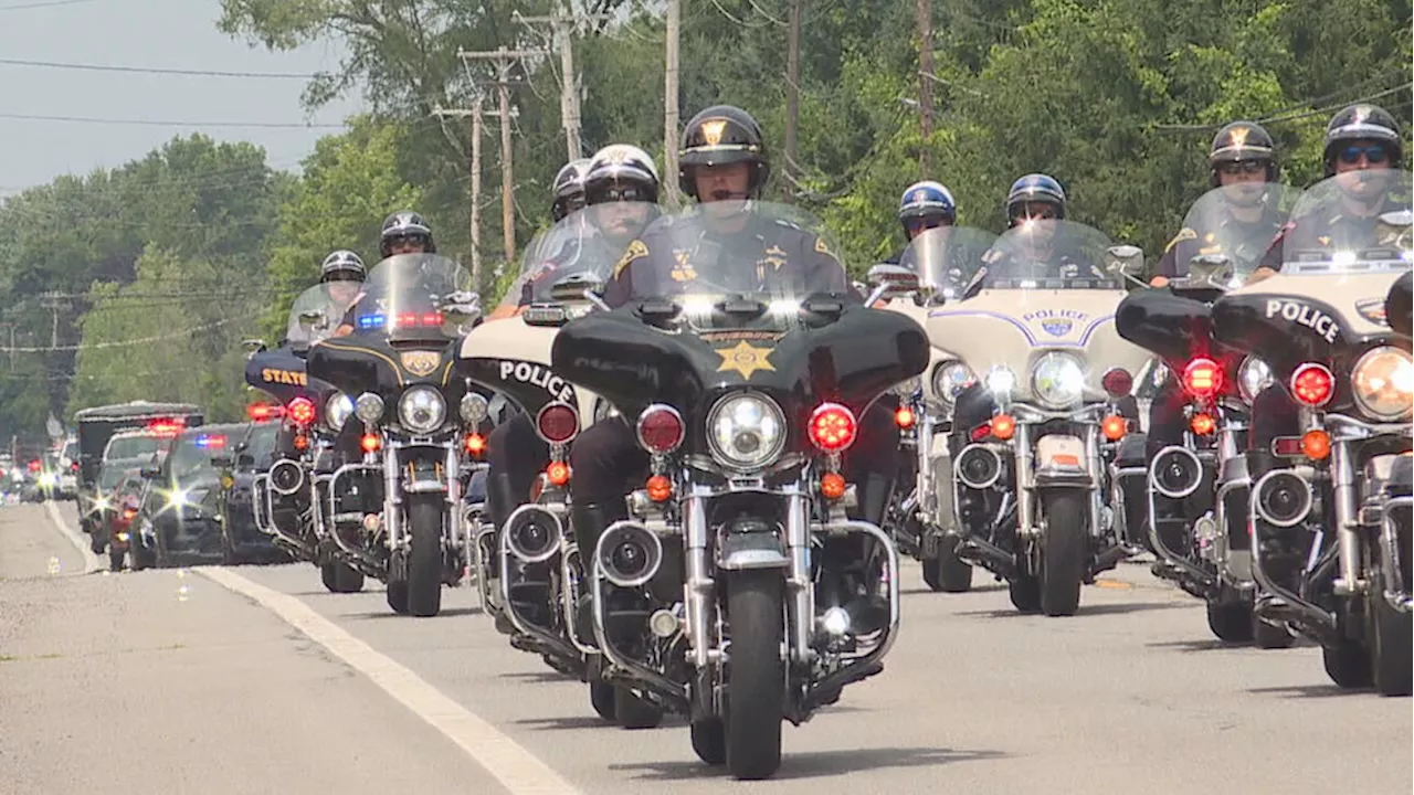 Local community honors fallen Cleveland police officer from Webster with procession