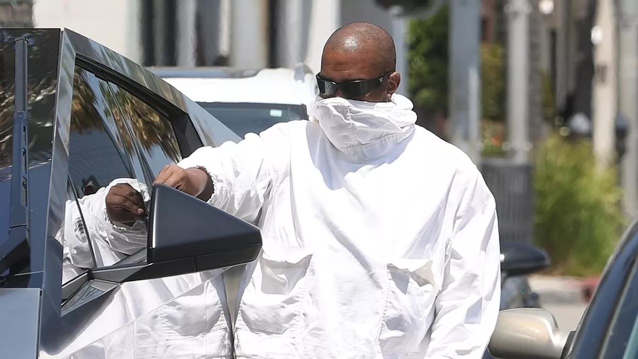 Kanye West shields his face during incognito outing in Beverly Hills - after announcing retirement...