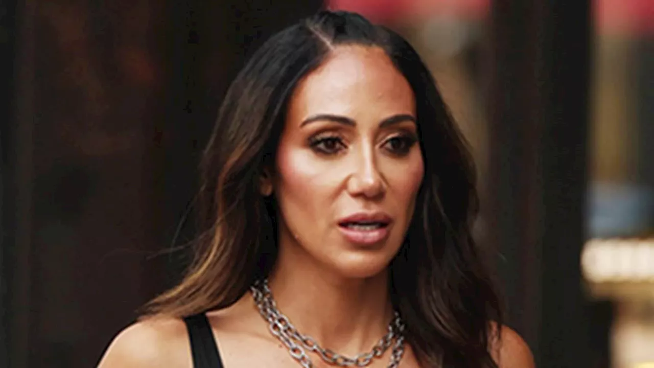 Melissa Gorga stuns in a mini skirt as she holds hands with husband Joe Gorga in NYC... after claims...