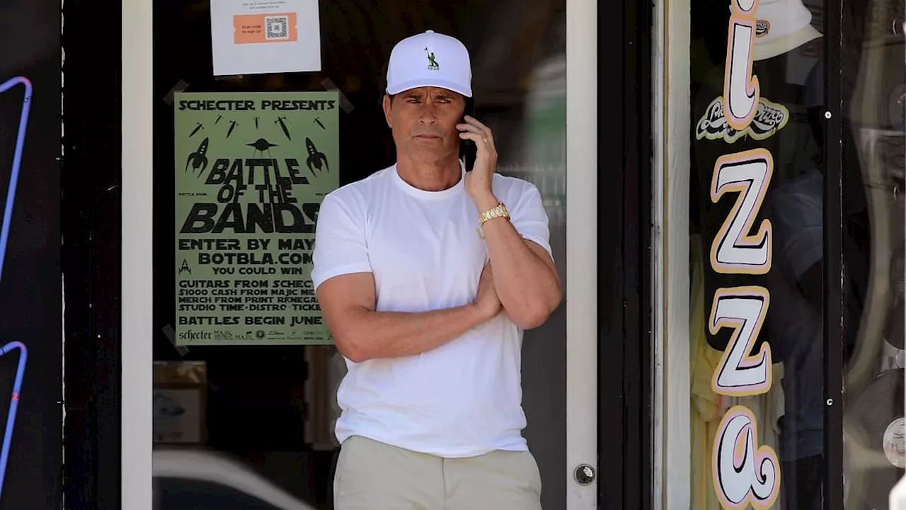 Rob Lowe, 60, looks youthful in white shirt and beige shorts outside a record store in LA... before...