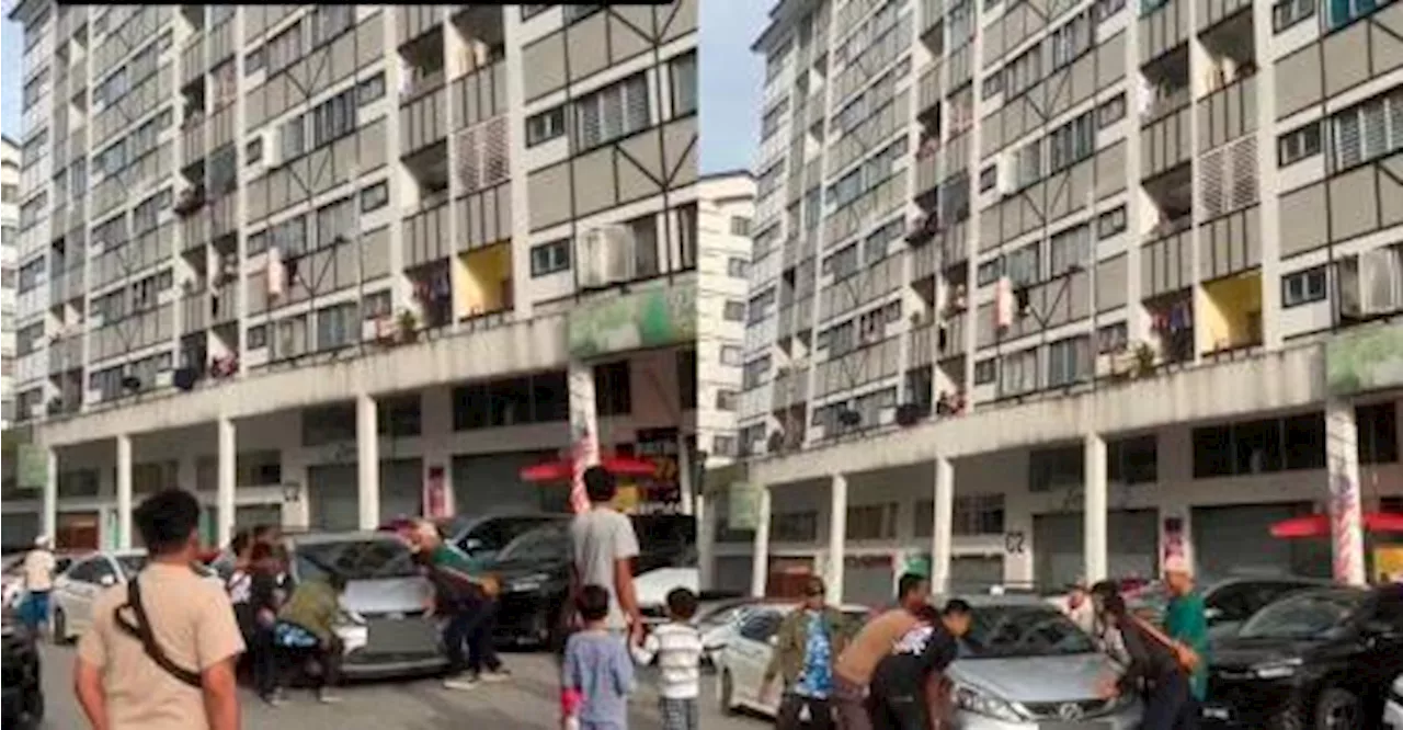 Malaysians unite to move double-parked Myvi at apartment