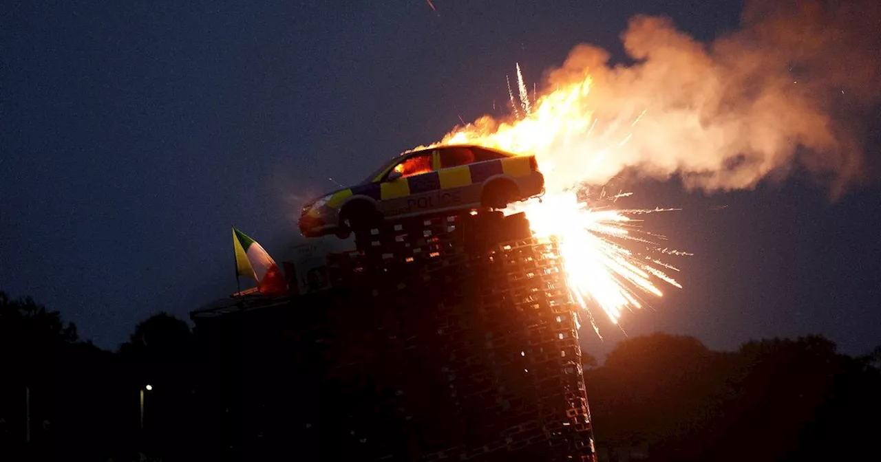 Watch: Bonfire set alight as 'police car' stunt slammed as 'disgraceful'