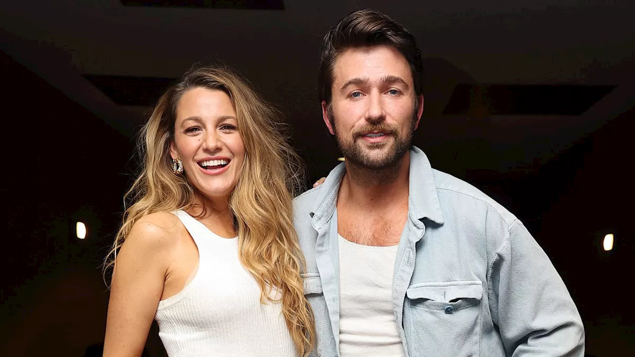 Blake Lively proudly takes credit for co-star Brandon Sklenar's custom floral jeans as they pose up...