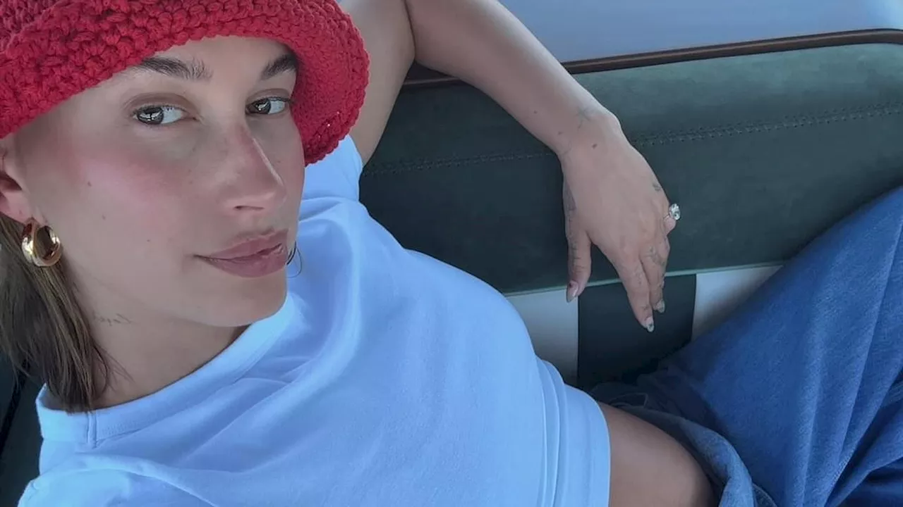 Hailey Bieber flaunts bump in summer slideshow featuring her husband Justin Bieber comparing her to...