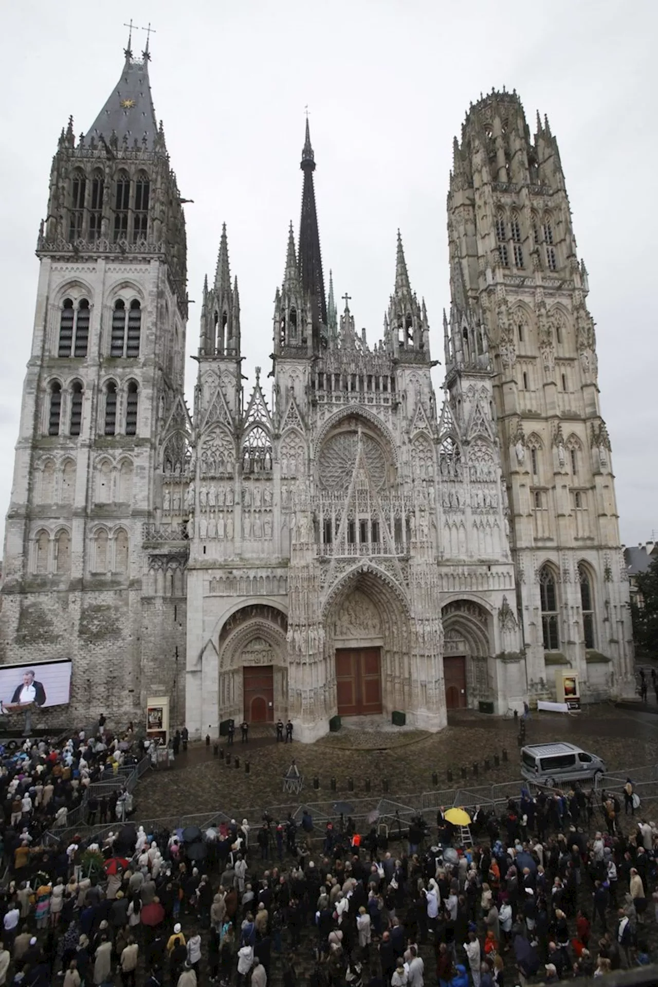 Fire in towering spire of medieval cathedral in French city of Rouen is under control