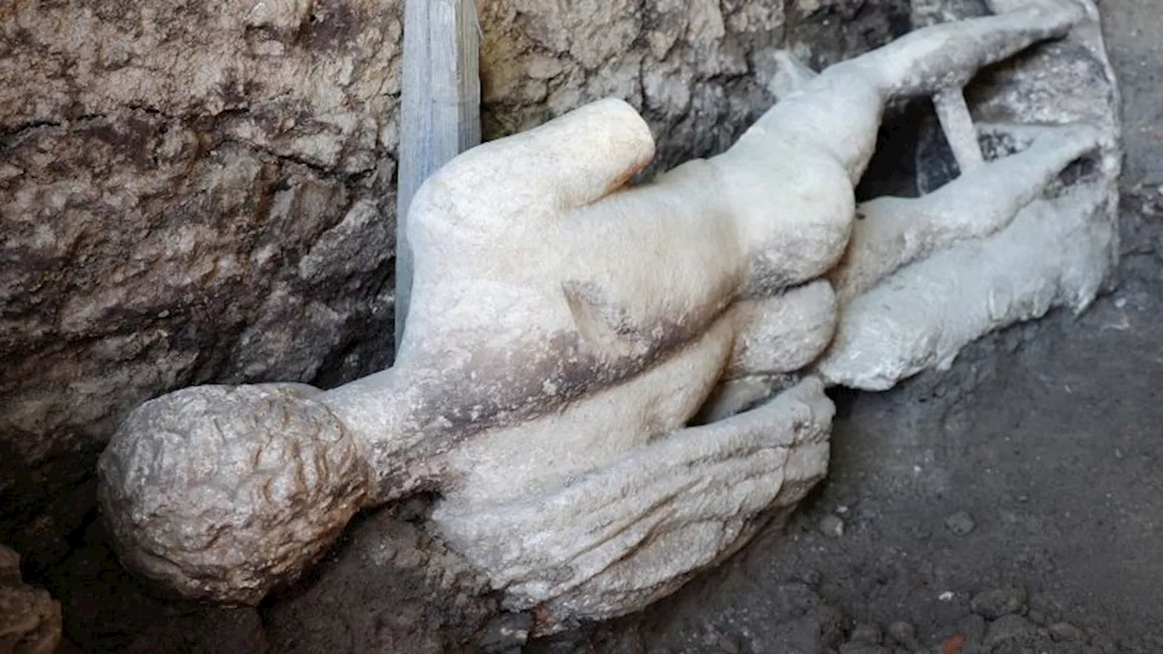 Archaeologists find marble god statue in ancient Roman sewer