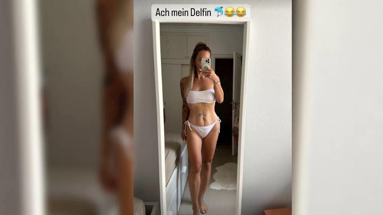 Danni Büchner zeigt ihr Delfin-Tattoo