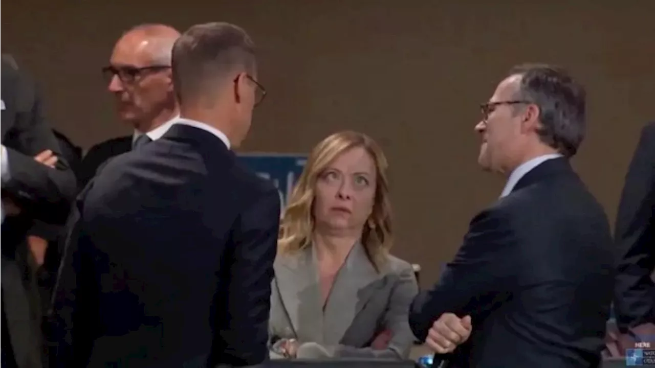 Italian PM rolls eyes, checks imaginary watch waiting for Biden at NATO summit