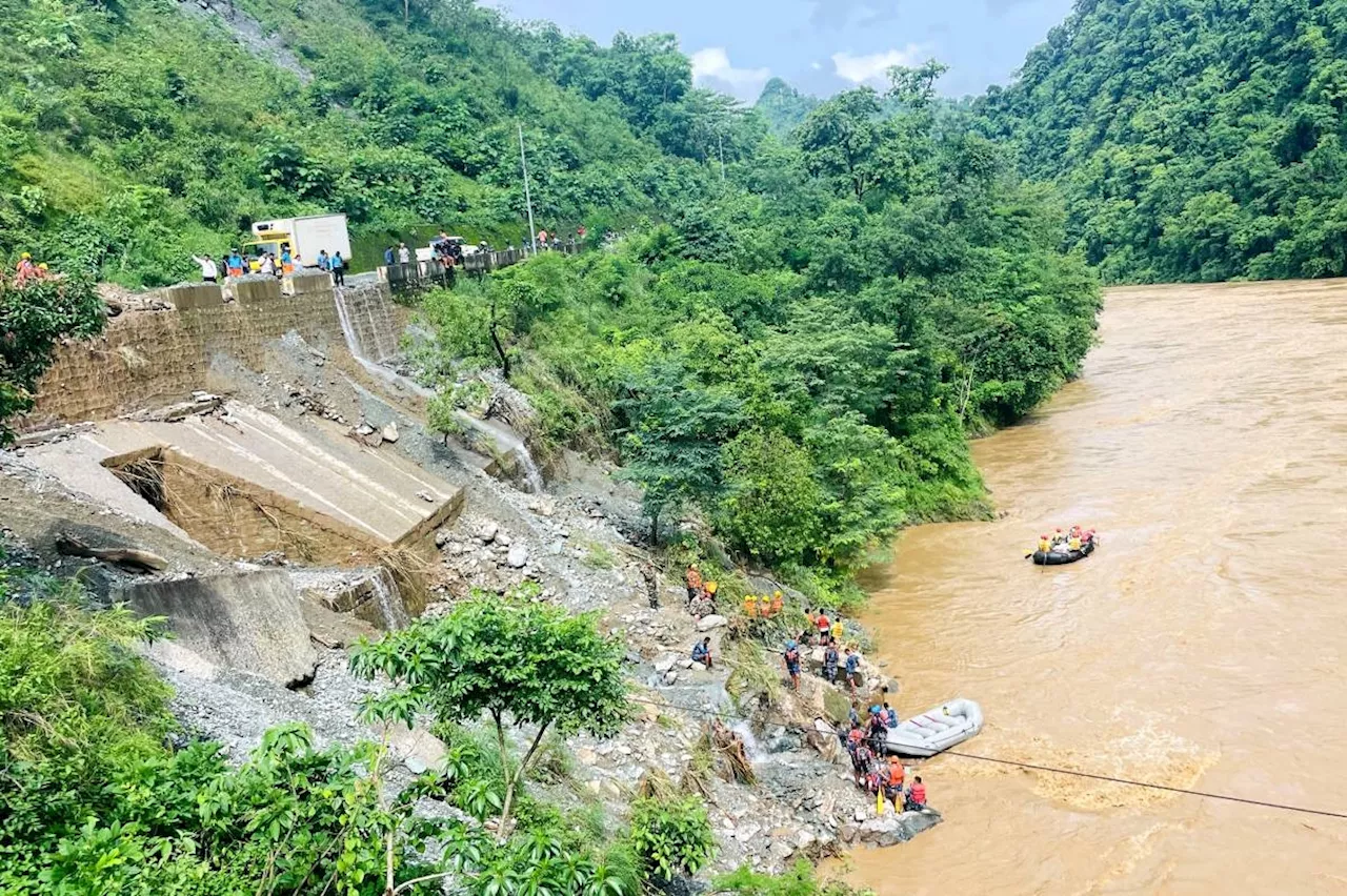 More than 60 missing after Nepal landslide sweeps two buses into river