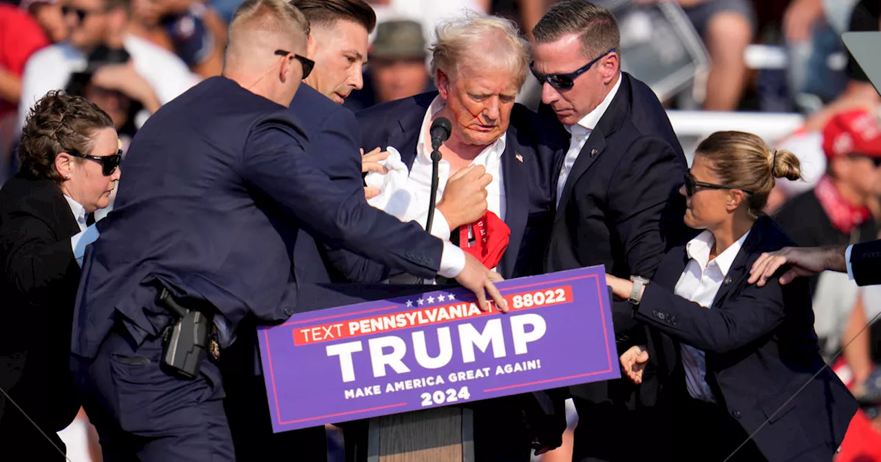 Possible shots fired at Trump rally, Trump rushed away by Secret Service