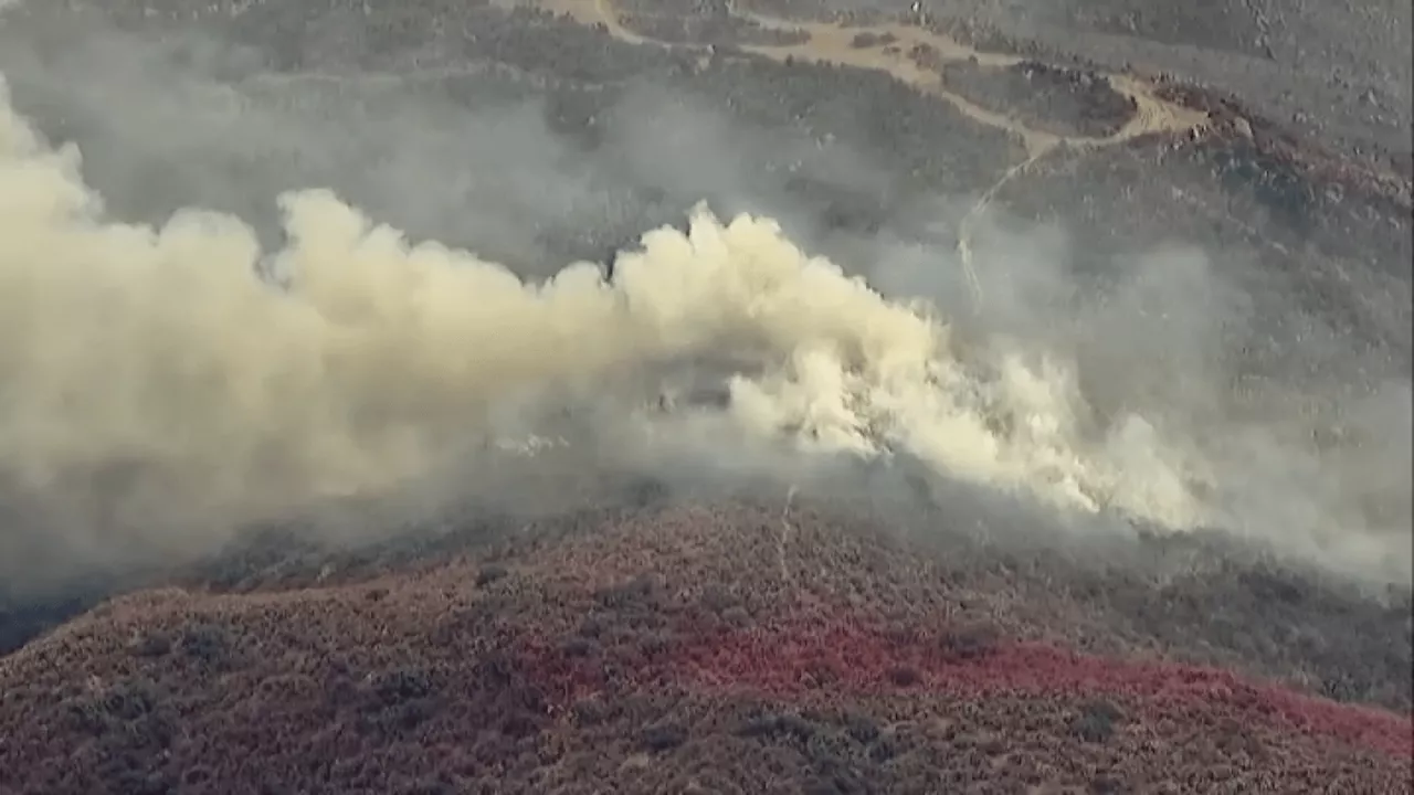 Fire crews stop forward progress of brush fire near Vail Lake in Temecula