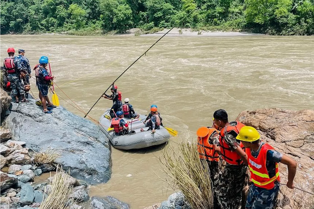 Nepal recovers first body from buses swept away by landslide