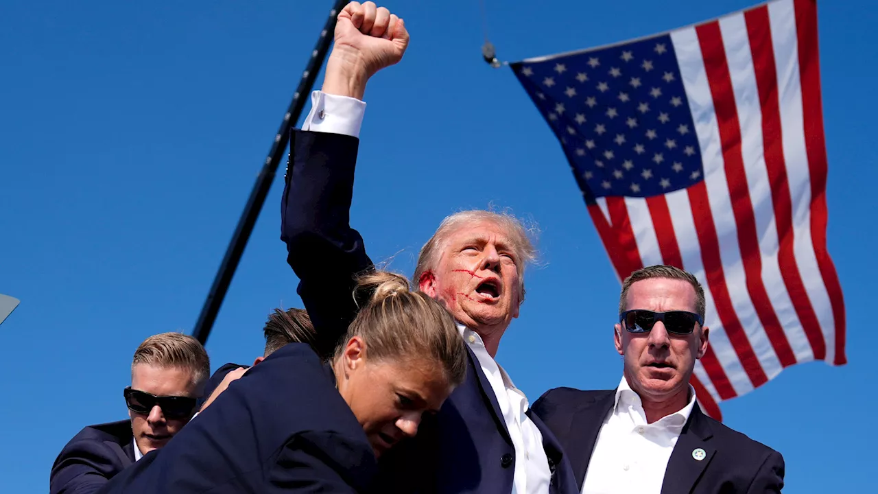 ‘Shots fired’ at Donald Trump rally with former president seen with blood covering face as Secret Service r...