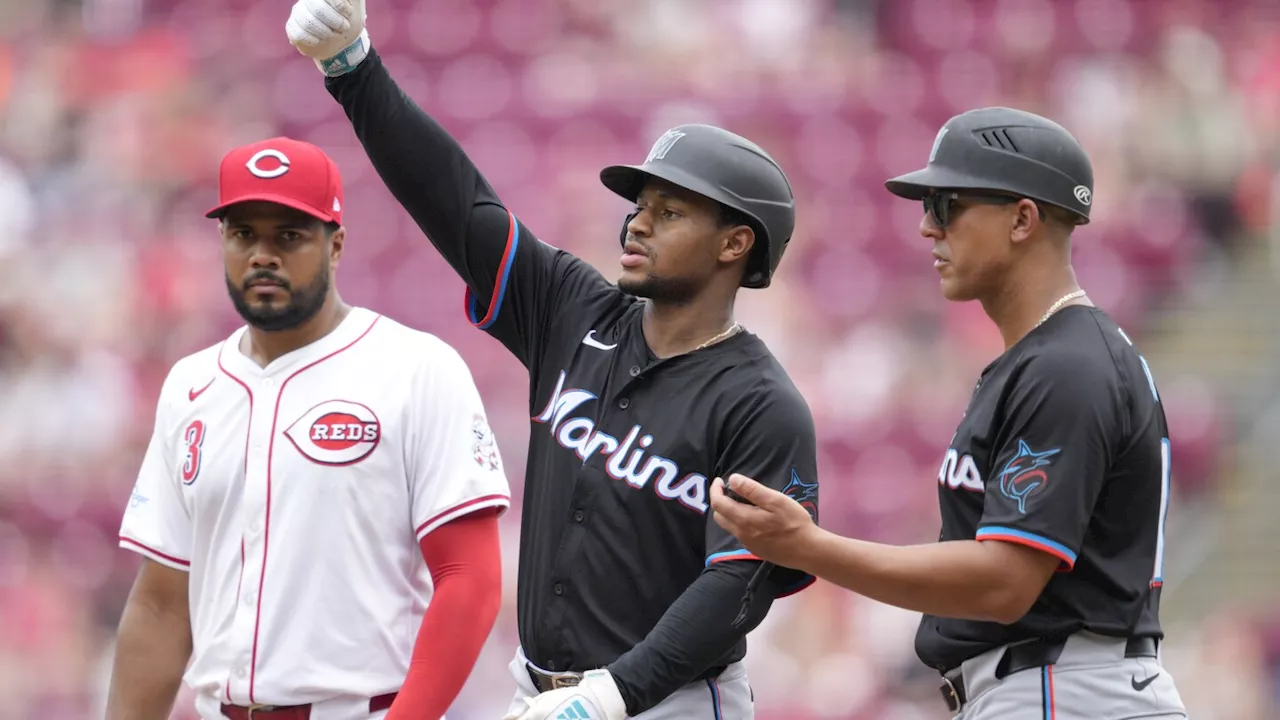 Marlins slip past Reds for 3-2 victory