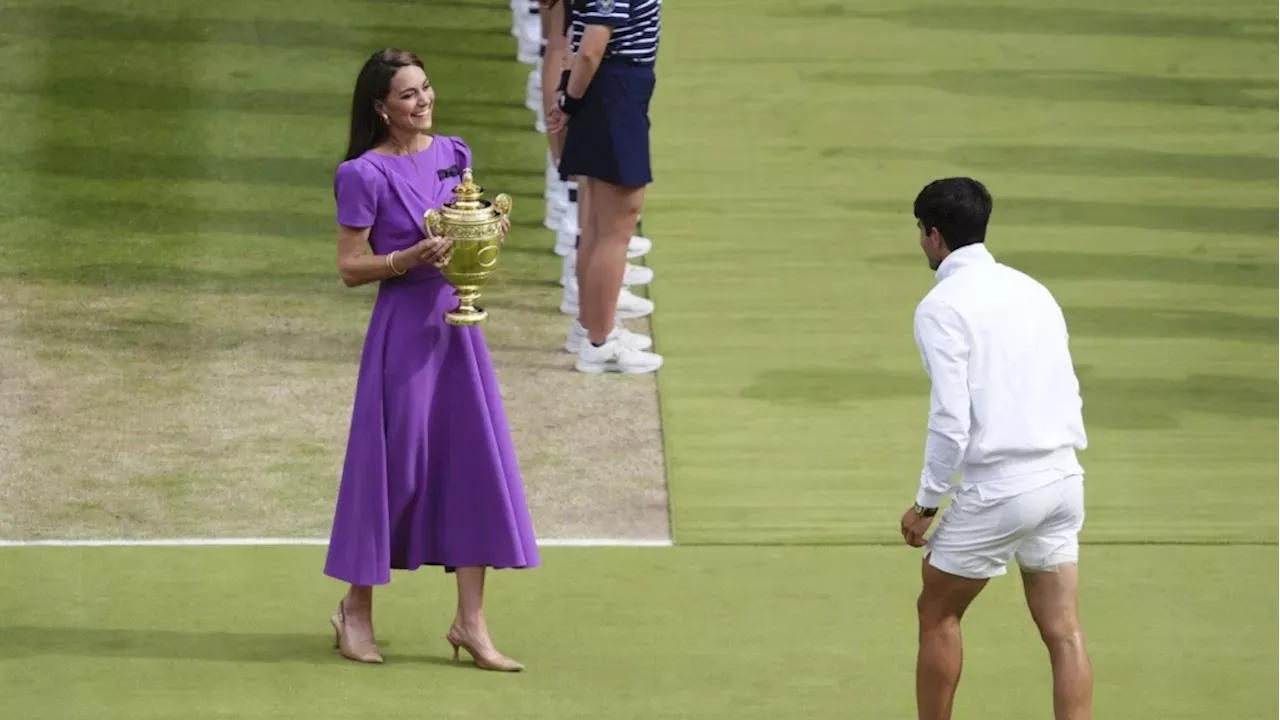 Kate, the Princess of Wales, hands Carlos Alcaraz his Wimbledon trophy