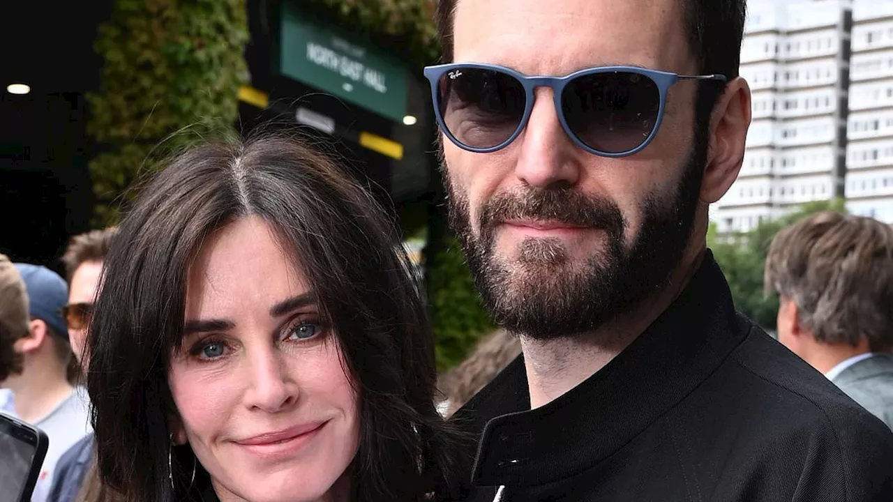 Courteney Cox cosies up to Snow Patrol rocker fiancé Johnny McDaid as they arrive for Wimbledon...