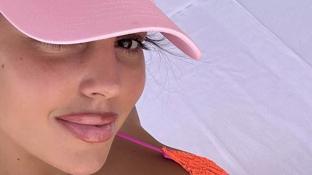 Georgina Rodriguez stuns in a skimpy bikini on family getaway while Cristiano Ronaldo looks in high...